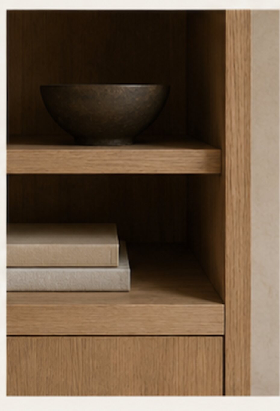 Oak shelving with a stone bowl, honest natural finishes